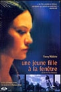 UNE JEUNE FILLE A LA FENETRE